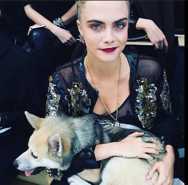 An image of Cara Delevingne with her Dog